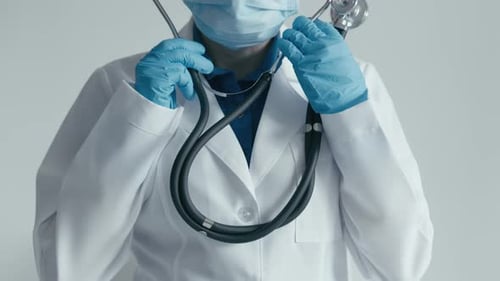 Doctor Puts Stethoscope Around Neck, Close Up