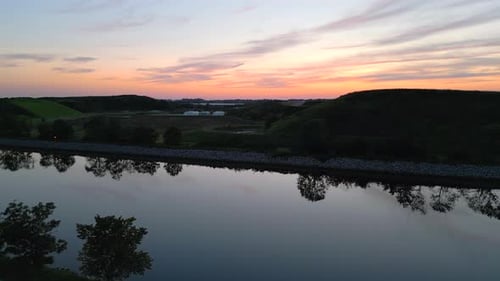 Aerial view of Sunset over riverlike stream