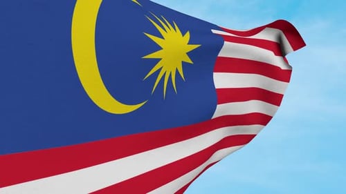 Malaysian Flag Waving Seamlessly Against Blue Sky