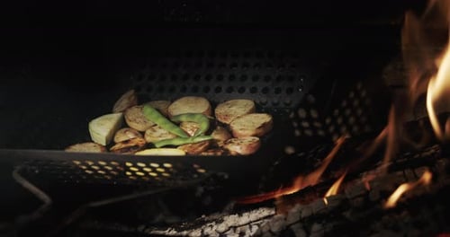 Potatoes with Asparagus are Fried Over Hot Coals