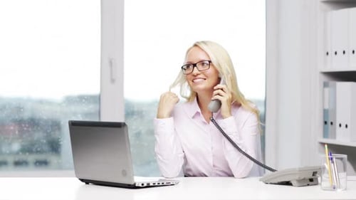 Smiling Woman Talking on Phone in Office