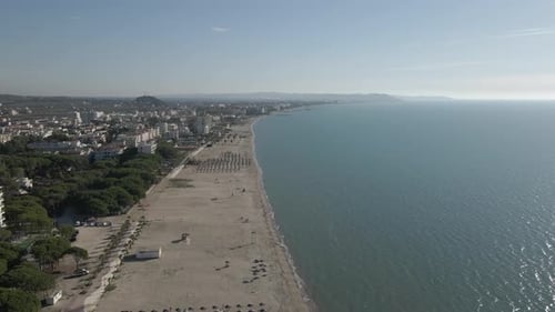 Long sandy beach on flat calm Adriatic Sea coast of Durres Albania