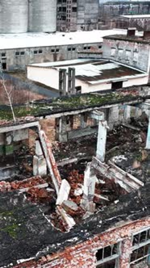 Devastated territory with ruins and wrecks at wartime.
