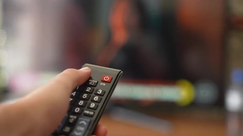 Turning off with remote controller close-up shot