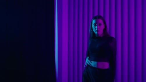 Sexy Brunette Woman Dancing Passionately In Studio With Neon Lights Young Female Dancer In Black