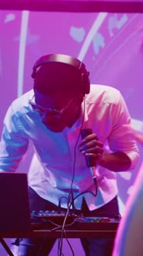 Vertical Video African American DJ Having Fun at Club