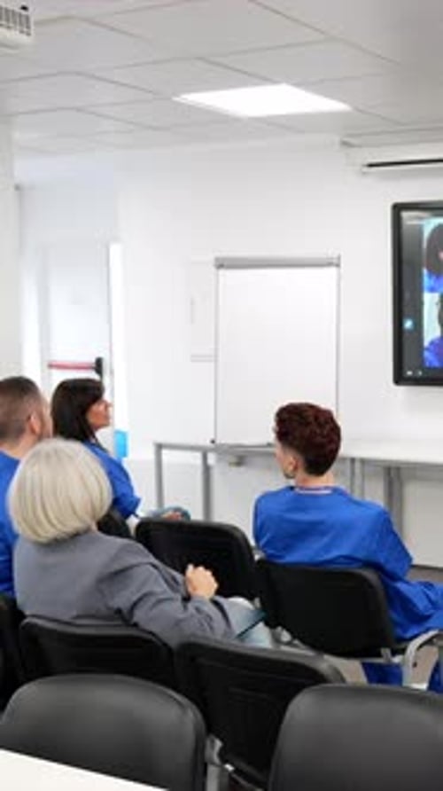 Business Meeting with Video Conference in a Modern Office