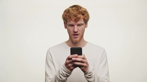 Young Adult Using Smartphone with Varied Expressions