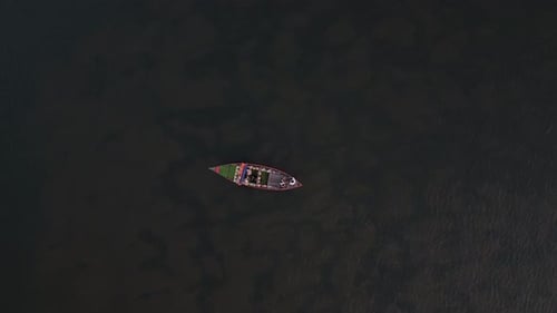 Flying Over a Tourist's Wooden Boat in the Thu Bon River in Hoi An Vietnam