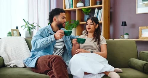 Young Couple Toasting With Coffee at Home