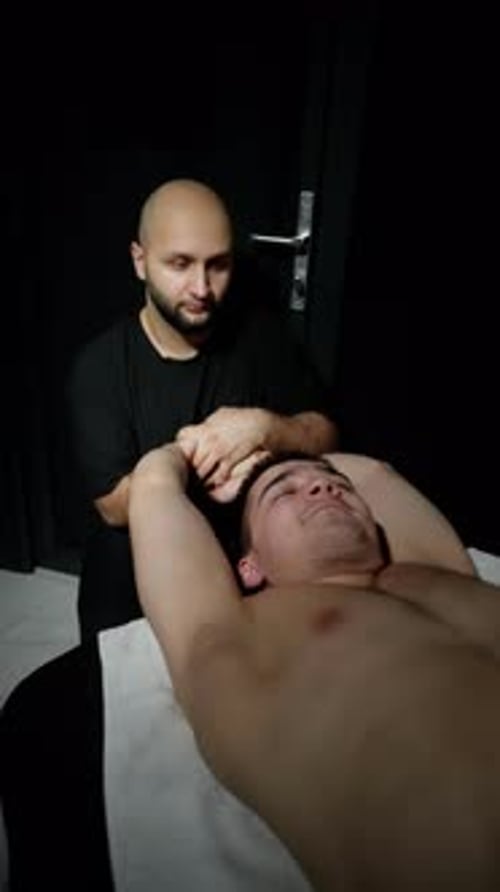 Relaxing Arm Massage in Dimly Lit Room