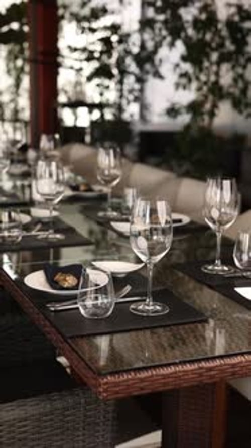 process of table setting for a banquet in a restaurant