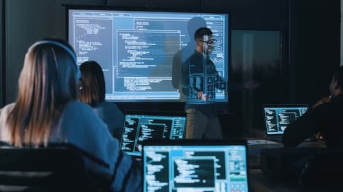 Software Development Class Studying Code at Night