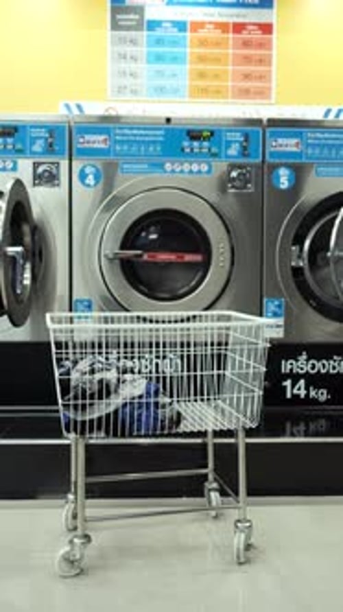 Laundry Cart in Urban Laundromat with Washers