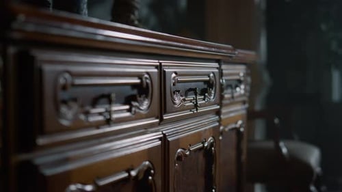 Ornate wooden dresser with drawers opening by key