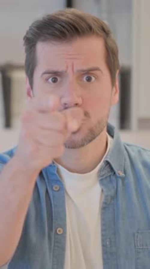 Frustrated Man Shouting and Gesturing at Camera