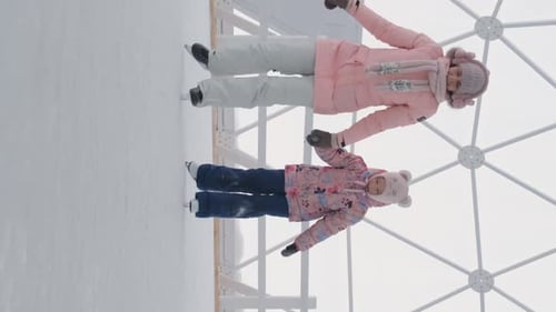 Woman with Daughter Ice Skating Together
