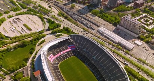 Empty Soldier Field Stadium neighboring busy highway and railway depot.