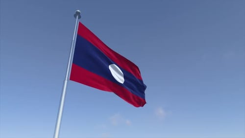 Laos Flag Waving on Flagpole Against Blue Sky
