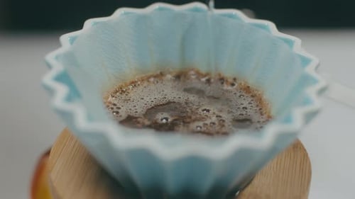 Water Pours Into Coffee Filter Close Up