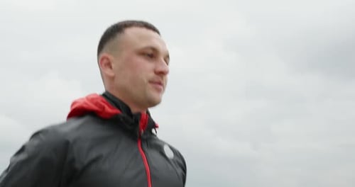 Man Doing High Knees Exercise Outdoors