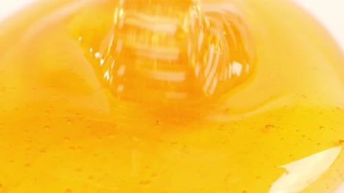 Honey Poured On The White Plain Background. Organic Thick Honey Sweet Dessert