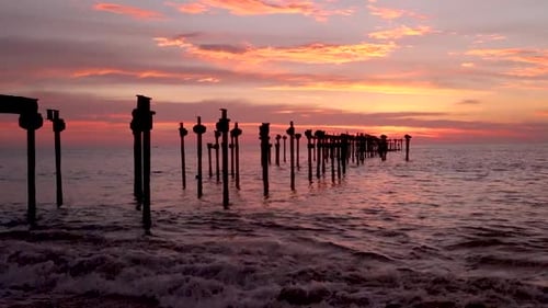 sunset colorful dramatic sky with iron pool leading line to the sea horizon at evening video taken a