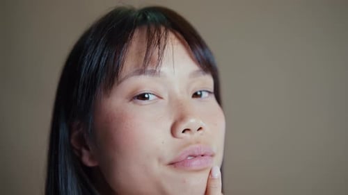 Asian woman beauty session in studio.