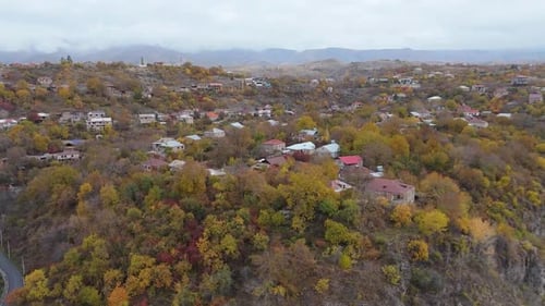 Aerial drone Garni village in autumn time, with mountains background in Armenia.