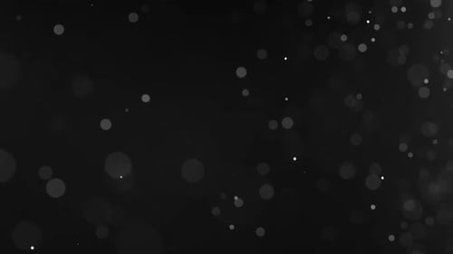 Abstract Particles Floating on a Black Background