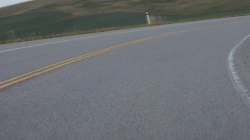 View of the asphalt road during a road trip in the countryside