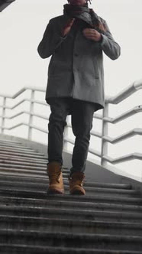 Walk in City in Autumn Black Man Going Down Over Stairs in Outskirts Vertical Portrait Urban