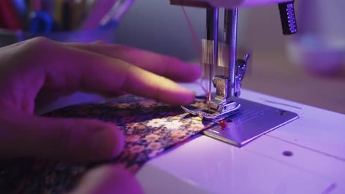 Sewing Machine Stitching Floral Fabric Close Up