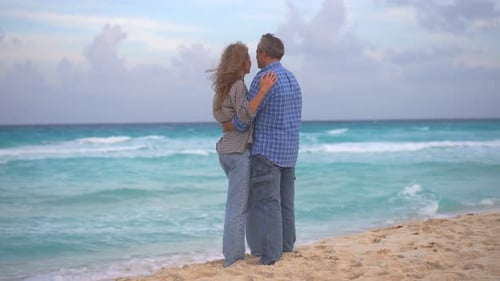 Romantic Middleaged Couple Enjoying a Peaceful Evening Together on the Beach Love Connection and