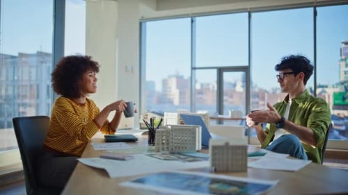 Real Estate Developers Talking at Coffee Break Sitting Modern Corporate Office