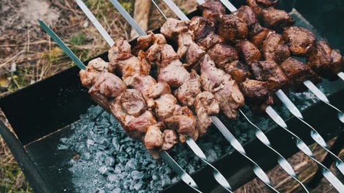 Delicious Grilled Meat Skewers Cooked Over Charcoal