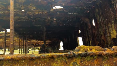 Interior of the decaying Maheno - the rusted hulk of a old shipwreck washed up on the beach of Frase