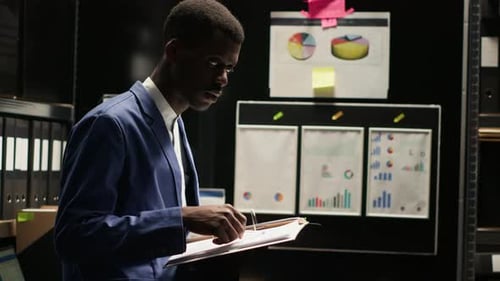 Investigator Examines Evidence in Office