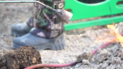 Connecting Black Pipes in a Trench with Torch
