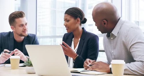 4k video footage of three business colleagues working together in their office