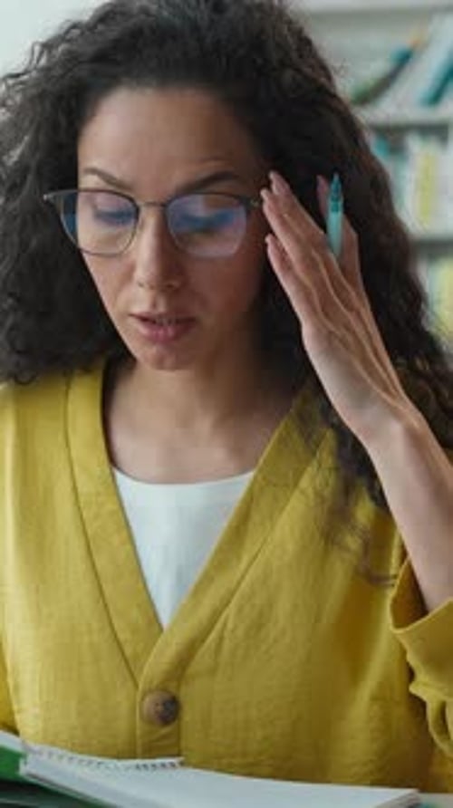 Indian Latina Hispanic Woman Professor Teacher Talking Online Meeting on Laptop in University