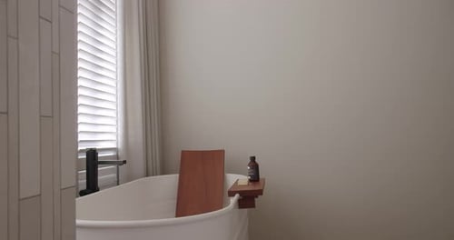 Minimalist Bathtub with Clean Design in Bright Bathroom