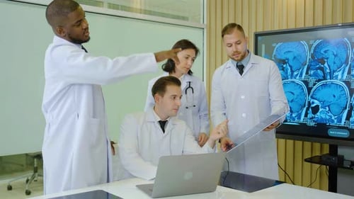 Doctors Reviewing Brain Scans in Bright Office