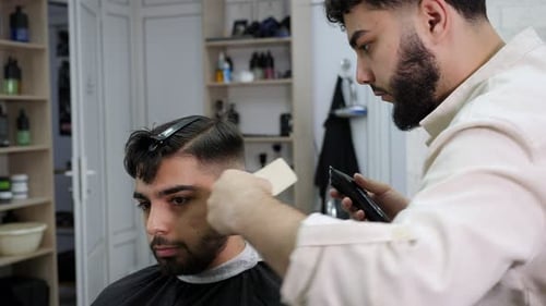 Barber Giving Haircut in Modern Barbershop