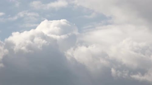 Clouds Moving Slowly Across the Blue Sky