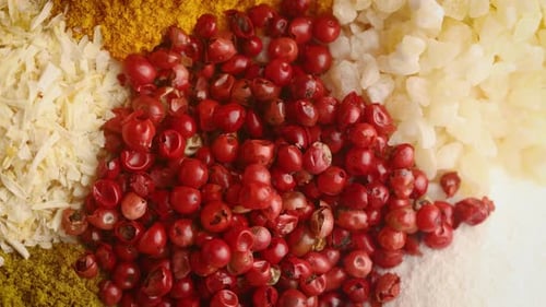 Colorful Spices: Peppercorns, Turmeric, Onion, and Garlic