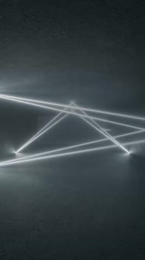 3D neon triangle glows on concrete floor