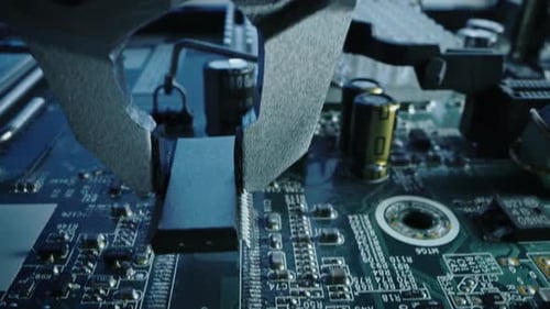 Factory Machine at Work: Printed Circuit Board Being Assembled with Robotic Arm, Surface Mounted Te