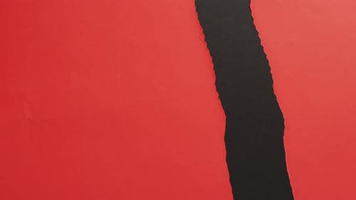 Ripped Red Paper Reveals Black
