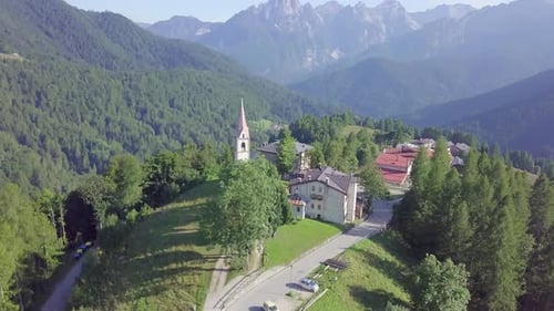 Drone flying around mountain village church